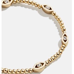 Christina Pisa-gold evil eye bracelet from Bauble Bar